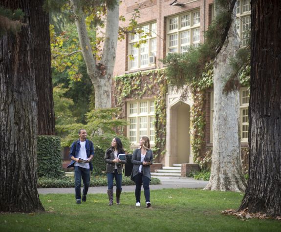 students walking on knoles lawn